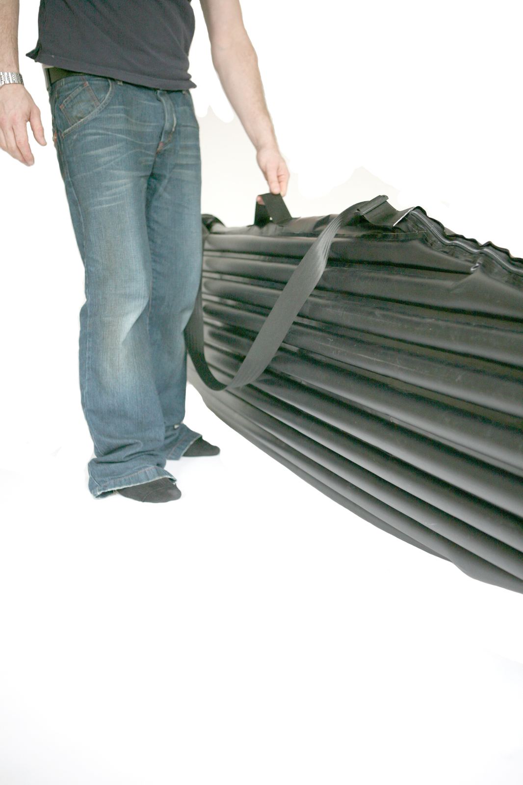 Full-length side profile of the inflated cover being carried